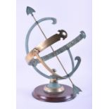 A large contemporary bronze sculpture of a spherical weather vane, on circular wooden stand, 54cm