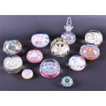 A collection of twelve assorted glass paperweights brightly coloured and of varying shapes and
