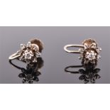 A pair of early to mid 20th century 9ct yellow gold and diamond floral cluster earrings each set