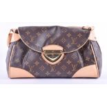 A Louis Vuitton monogram handbag with gold coloured clasp and suede interior, 19 x 34 cm, 12 cm wide