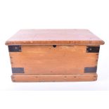 A small Victorian pine trunk with wrought iron handles and metal strap work. 61 cm wide.