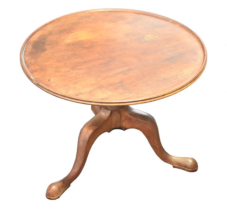 A George III mahogany tilt-top supper table with cut down base, supported on turned column, and