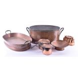 A selection of antique domestic copper wares to include a large lidded zinc-lined pan of oval form