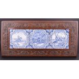 Three blue and white tiles in an oak frame with narrative scenes to include a man on horseback, a