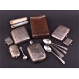 A small collection of assorted silver items including two silver cigarette cases, two silver vesta