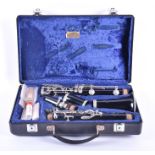 A cased French Buffet Crampon clarinet model B12, in five sections, set within a felt lined case,
