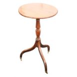 A 19th century oak wine table with circular top, supported on turned baluster column, tripod legs