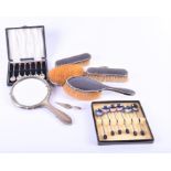 A collection of silver items to include a George V five-piece tortoiseshell backed dressing set,