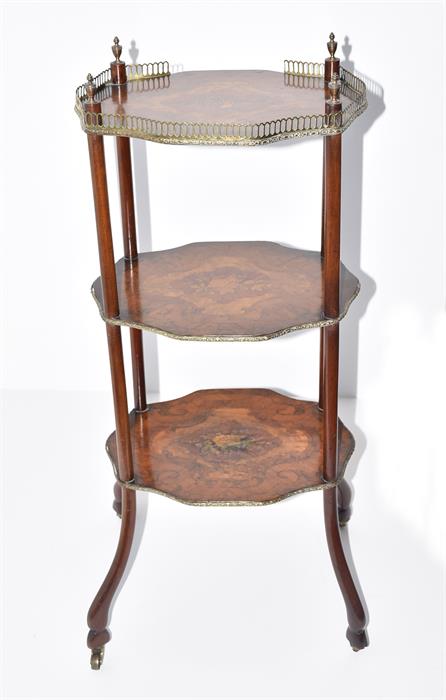 A 19th century three tier French inlaid étagère the shaped top with brass gallery, and inlaid with