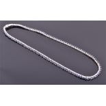 An 18ct white gold, diamond and sapphire collarette necklace set with one hundred and sixteen