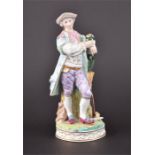 A 19th century porcelain Meissen figure of a young gallant leaning on a watering can upon a tree