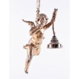 A gilt metal hanging cherub light the cherub with arm out-stretched, holding a light fitment.