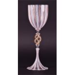 A Murano Latticino lampwork goblet the clear body and base with latticed red and white decoration,