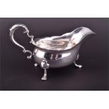 A George II silver sauceboat London 1744, possibly John Barbe, of boat-shaped form with scalloped