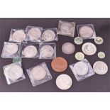 A collection of assorted Continental coinage including an 1885 silver one dollar coin, two Belgian