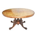 A Victorian mahogany and walnut loo table the inlaid oval top in quarter burr walnut veneers,