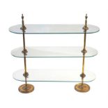 An unusual adjustable bank of brass display shelves the pillar supports each with three adjusting