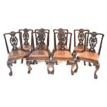 A set of eight 19th century mahogany Chippendale style dining chairs with scrolling pierced backs