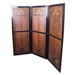 An Art Nouveau style three-fold screen/room divider the ebonised frame accommodating stretched