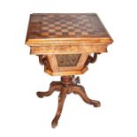 A late 19th/early 20th century veneered wood work table the hinged lid inset with a chess board,