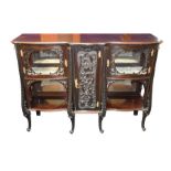 A Victorian stained mahogany sideboard with glazed panelled cupboards and carved acanthus
