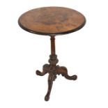 A Victorian figured walnut wine table with quarter veneered circular top, with central foliate and