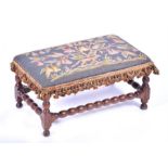 A late 17th century fruitwood footstool with bobbin turned supports and turned stretchers, with