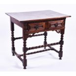 A 17th century oak side table the plain two plank top over a single frieze drawer with brass pear