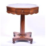 A William IV rosewood octagonal top drum table the inset leather top, over four fitted frieze