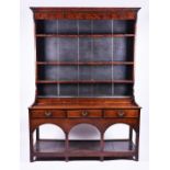 A late 18th century Welsh oak dresser of good colour, the top with three shelves set with iron