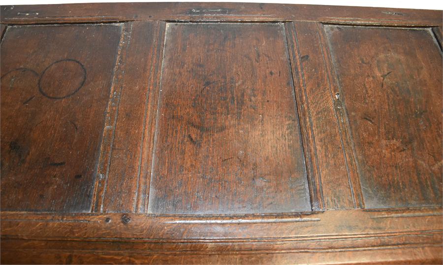 A 19th century oak chest with hinged three-panelled lid, panelled sides, raised on four straight - Image 2 of 2