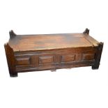 An unusual 18th century or earlier rustic provincial French oak chest with planked top, panelled