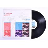 A signed Duran Duran 12 inch single 'Girls on Film' signed for Bill Harrison, together with a