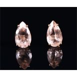 A pair of yellow metal and morganite ear studs each set with a pear cut morganite of approximately
