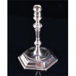 A George II silver taperstick London 1745, by John Café, with knopped stem and supported on a