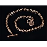 A 9ct yellow gold Albert bar necklace the cable link chain suspended with a heart shaped pendant, 11