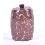 An ornamental Serpentine stone pot in the form of a barrel with lid, 8.5 cm high.