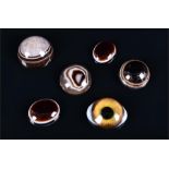 A quantity of five cabochon banded agate of various sizes and shapes, together with a glass eye. (