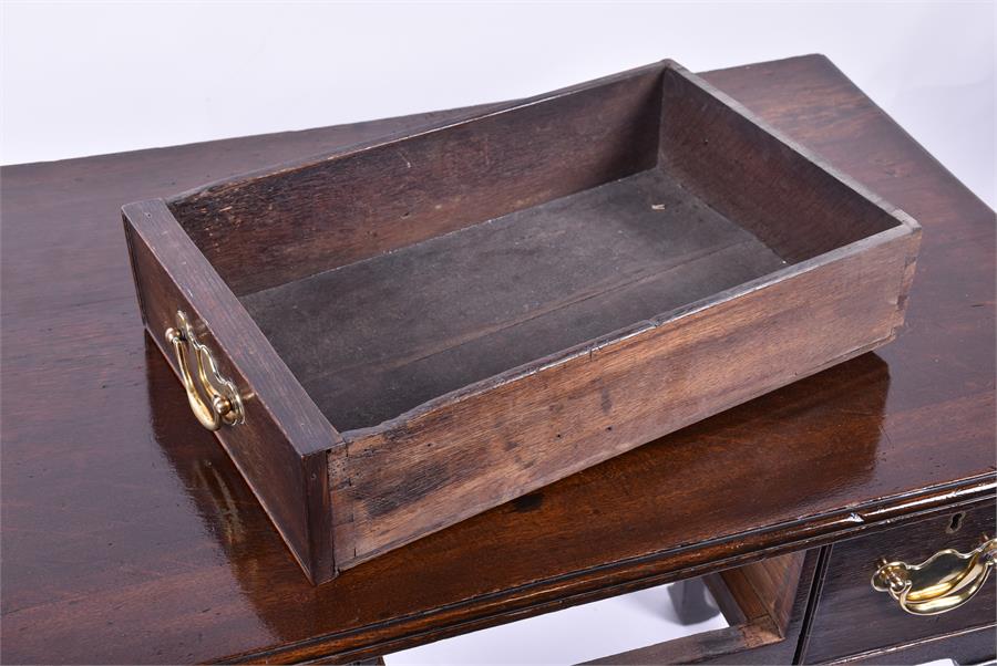An 18th century oak lowboy the rectangular top with moulded rim, over three small drawers with brass - Image 3 of 3