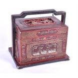 A late 19th / early 20th century Chinese crimson lacquer chest of rectangular form, the panelled