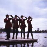 A limited edition square format photograph of The Kinks posing beside Hyde Park's Serpentine Lake