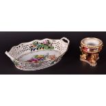 An early 20th century Dresden porcelain basket painted with flowers, with pierced decoration and