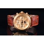 An 18ct yellow gold Maurice Lacroix automatic chronograph wristwatch the engine turned gilt dial