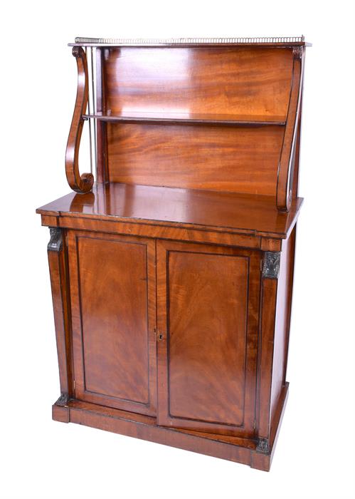 A Regency mahogany chiffoniere in the Egyptian taste the top with brass gallery scrolled sides,