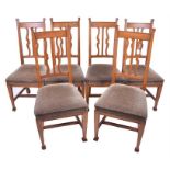 A set of six Robson & Co. oak framed Arts and Crafts chairs  with green fabric seats, with carved