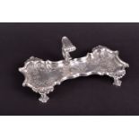 A George II silver snuffer tray London 1749, by John Cafe, of shaped form, the rim chased with