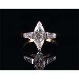 An 18ct yellow gold and diamond ring set with a marquise cut diamond of approximately 1.10 carats,