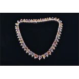 An impressive 18ct white gold, diamond, and multi-gemstone necklace comprising pink and blue