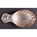 A silver caddy spoon in the form of a shell Birmingham 1969, by A Marston & Co, 8 cm high, 0.67 ozt.