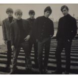 A black and white photograph of the Rolling Stones photo from their first photo session, taken on